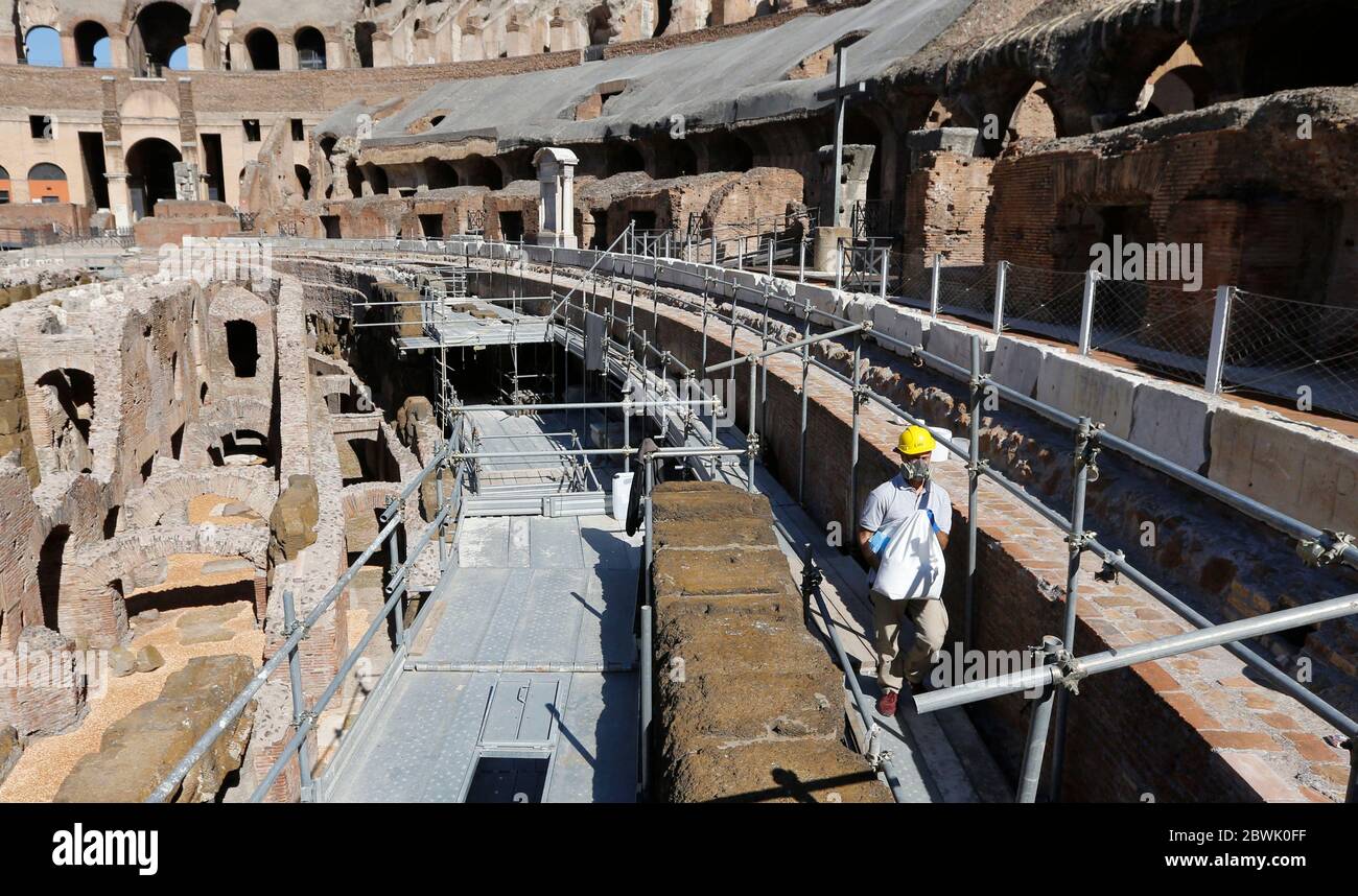 Rome, Italy. 01st June, 2020. A restorer works at the Colosseum. The monument and other landmarks of its Archeological Park, such as Roman Forum, Palatine Hill and Domus Aurea, reopen to the public after more than two months of closure due to the Covid-19 pandemic. Credit: Riccardo De Luca - Update Images/Alamy Live News Stock Photo