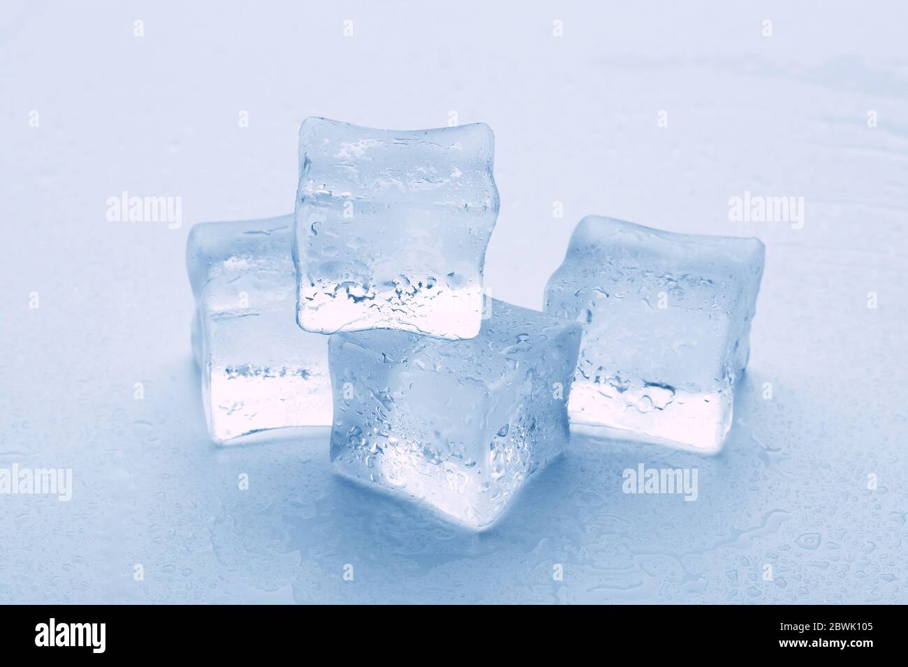 Melted ice cubes close up isolated on white background Stock Photo - Alamy