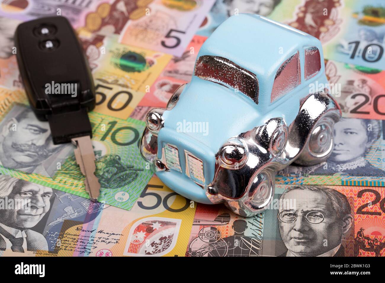 Car with key on a Australian dollars background Stock Photo