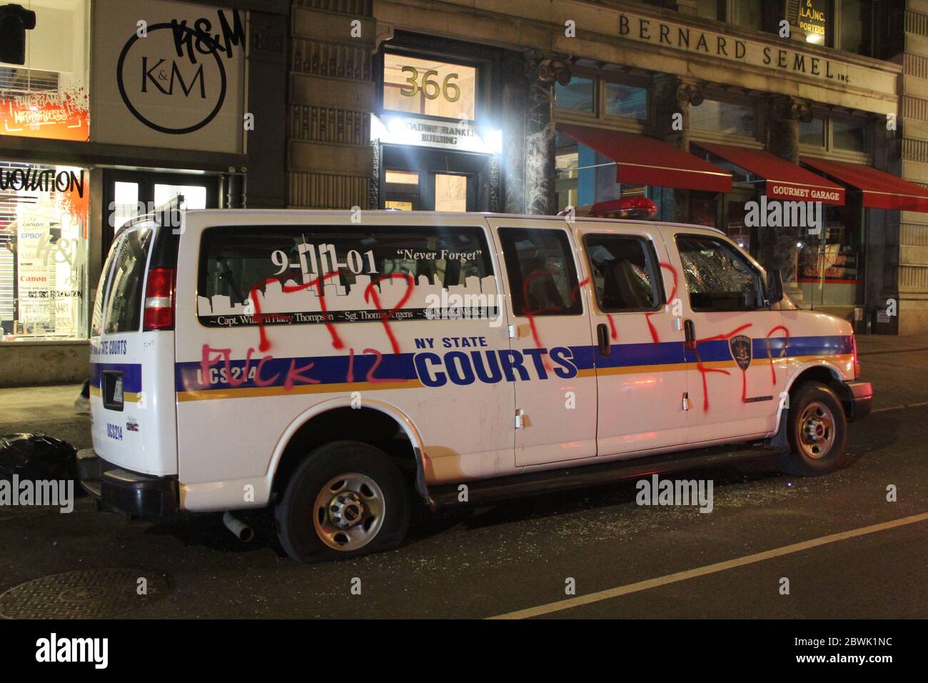 May 31, 2020, New York, New York, USA: Day of peaceful NYC marches gives way to chaos after dark after 4th day of protests over deathÃ‚Â ofÃ‚Â George Floyd.Ã‚Â Looters stormed Lower Manhattan, destroying multiple stores,Ã‚Â stealing items,Ã‚Â lighting fires,Ã‚Â and clashing with police all night long. This NY State Courts car was tagged and one of its tires was punctured. Officials and police believe it is the result of well-organized groups infiltrating peaceful protests, turning them into a riot.Ã‚Â The NYPD arrested more than 250 people. New York City decided to impose a curfew from 11:00 p Stock Photo