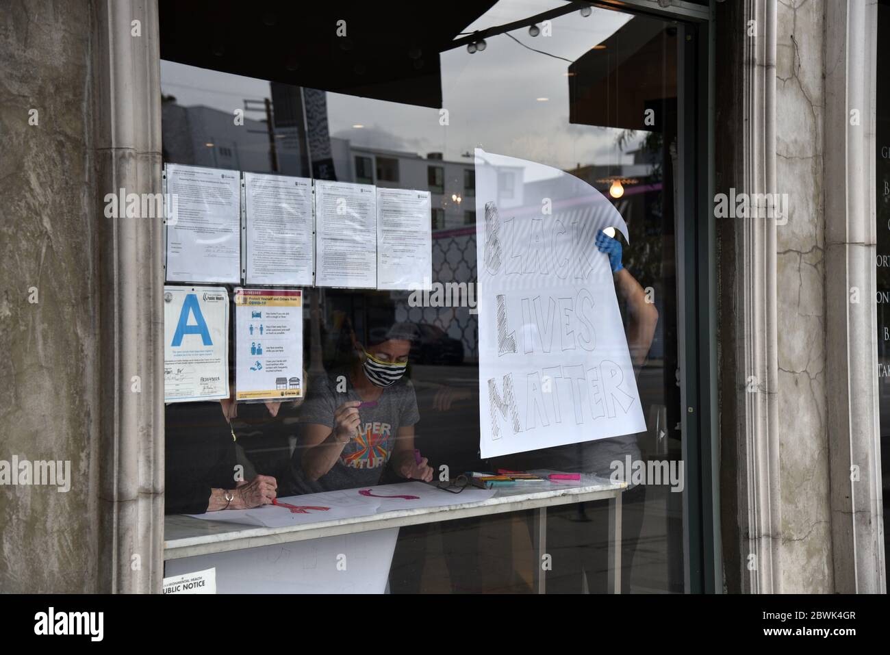 Los Angeles, CA/USA - May 30, 2020: A Third Street business posting a Black Lives Matter sign in their window during the protest over the George Floyd Stock Photo