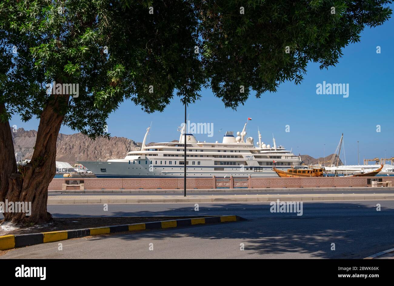 View across Corniche towards luxury yacht Al Said in Sultan Qaboos Port ...