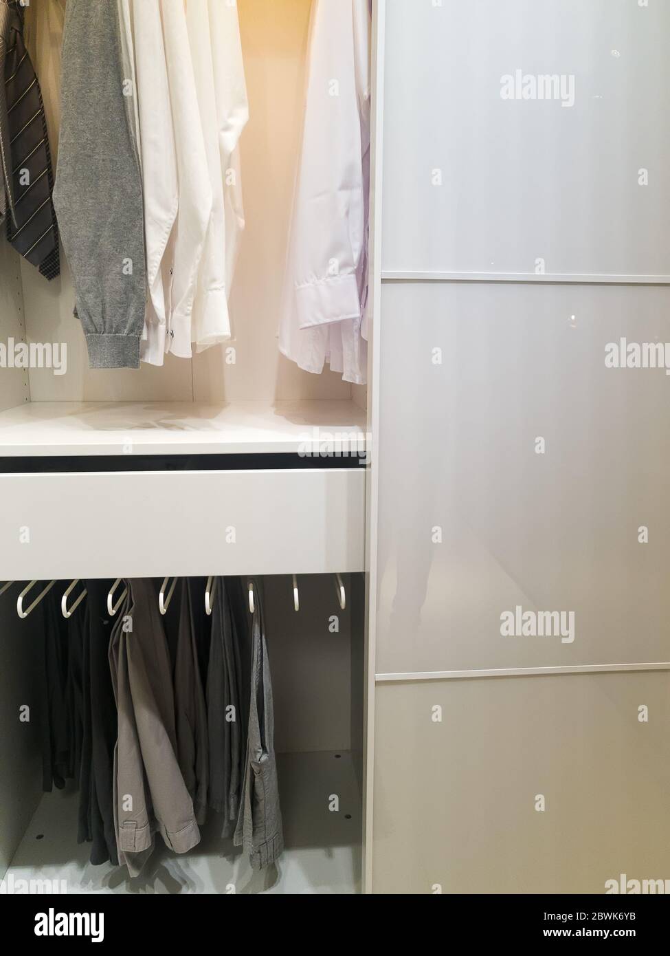 walk -in closet with cloth and shelf at home Stock Photo