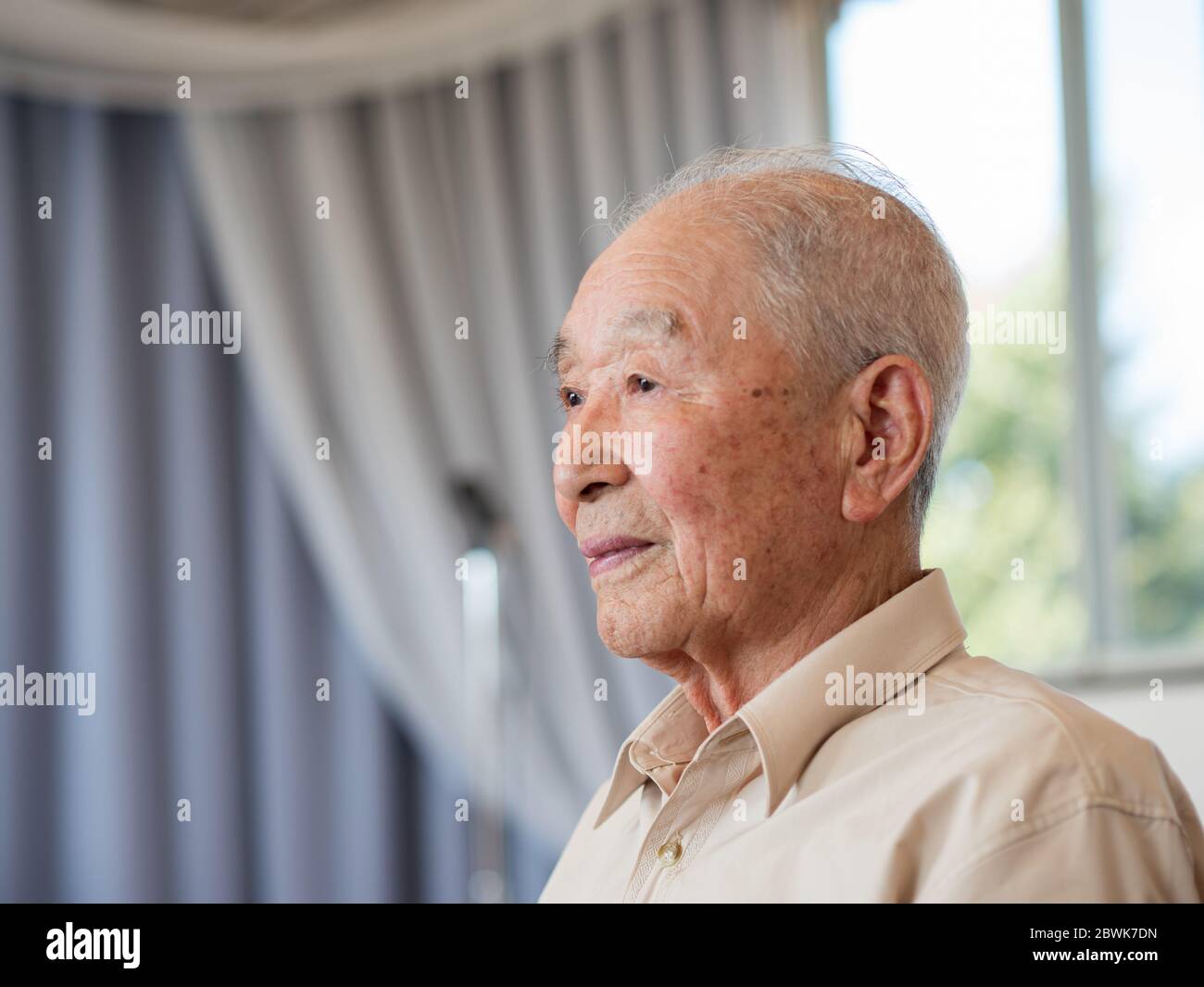 A healthy senior citizen looking off camera Stock Photo
