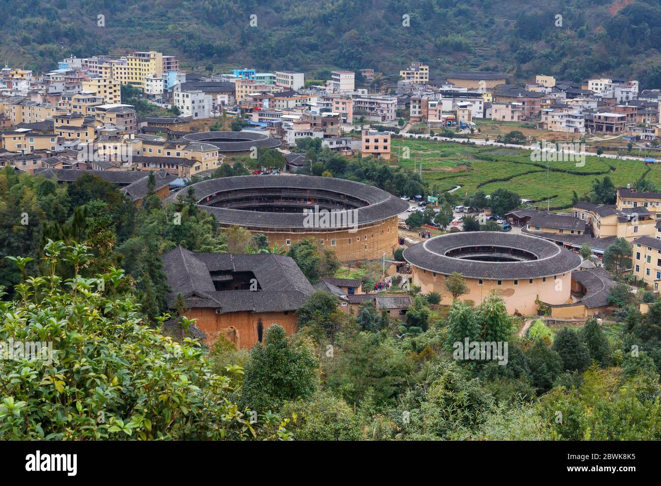 Three Fujian Tulou & surrounding landscape Stock Photo
