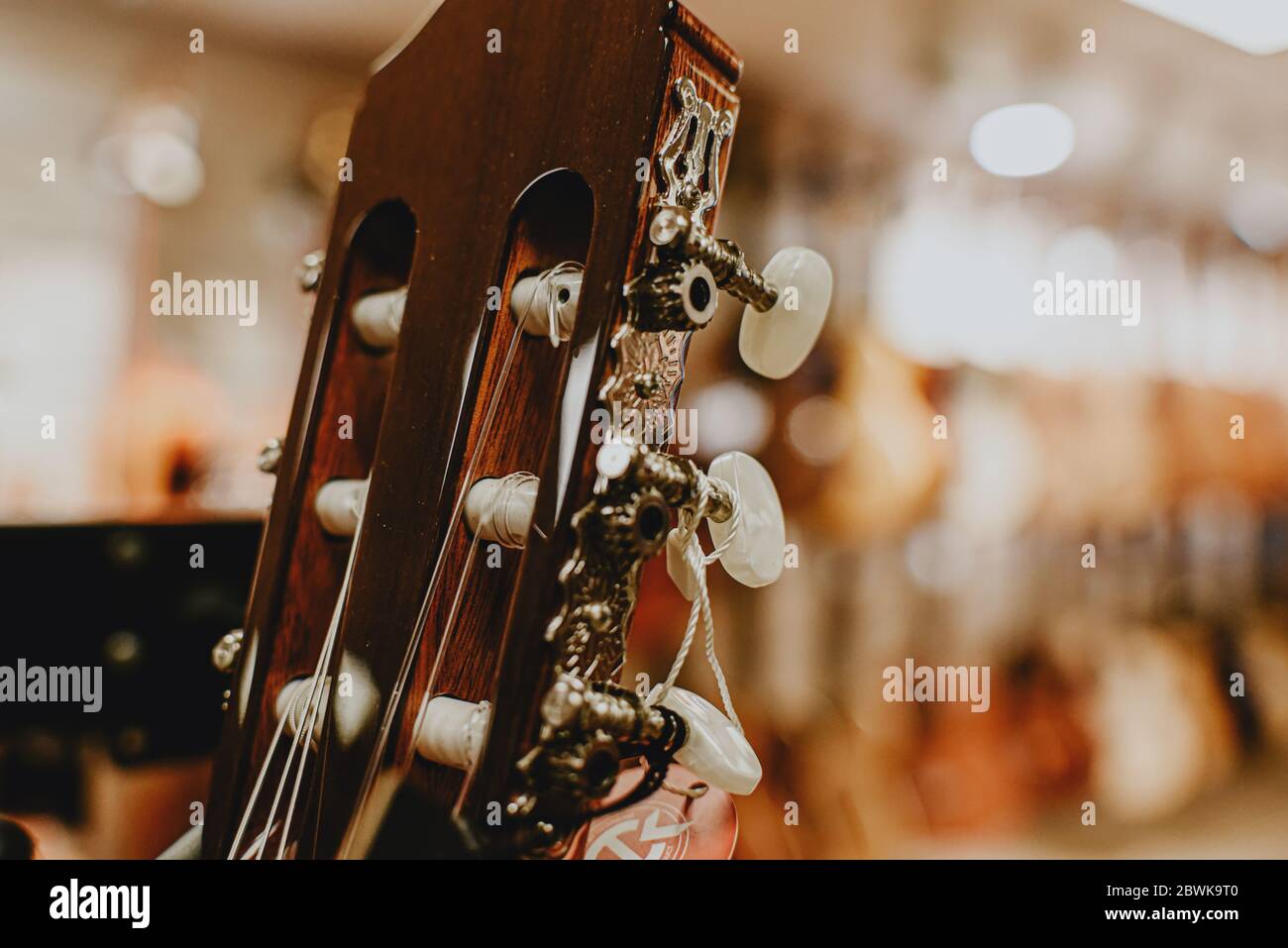 the head of the guitar. pin mechanism Stock Photo