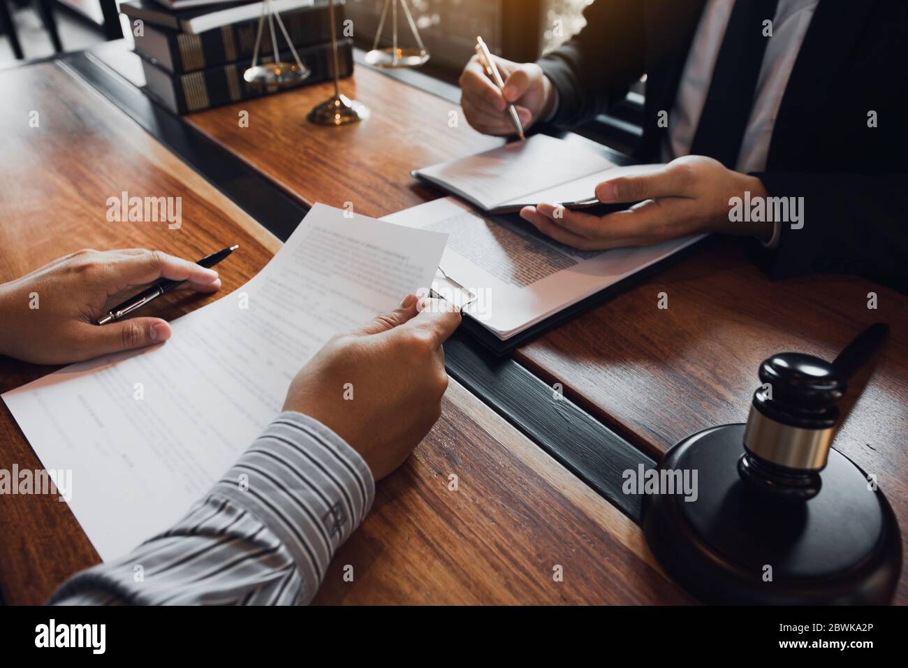 Lawyer is providing information about the client's trial at the lawyer