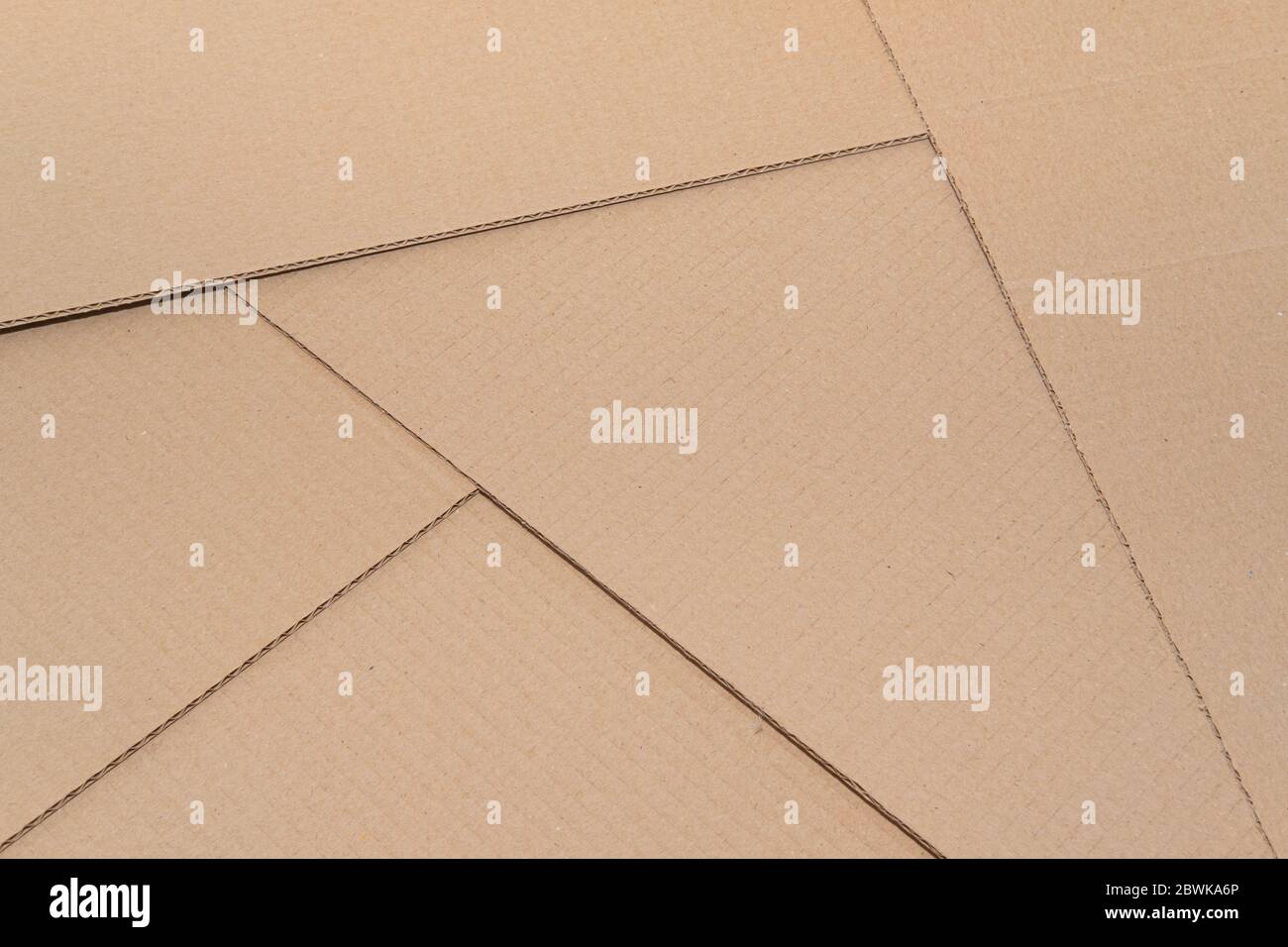 Cardboard paper backdrop, textured background. Natural packaging, brown recycled paper with text copy space Stock Photo