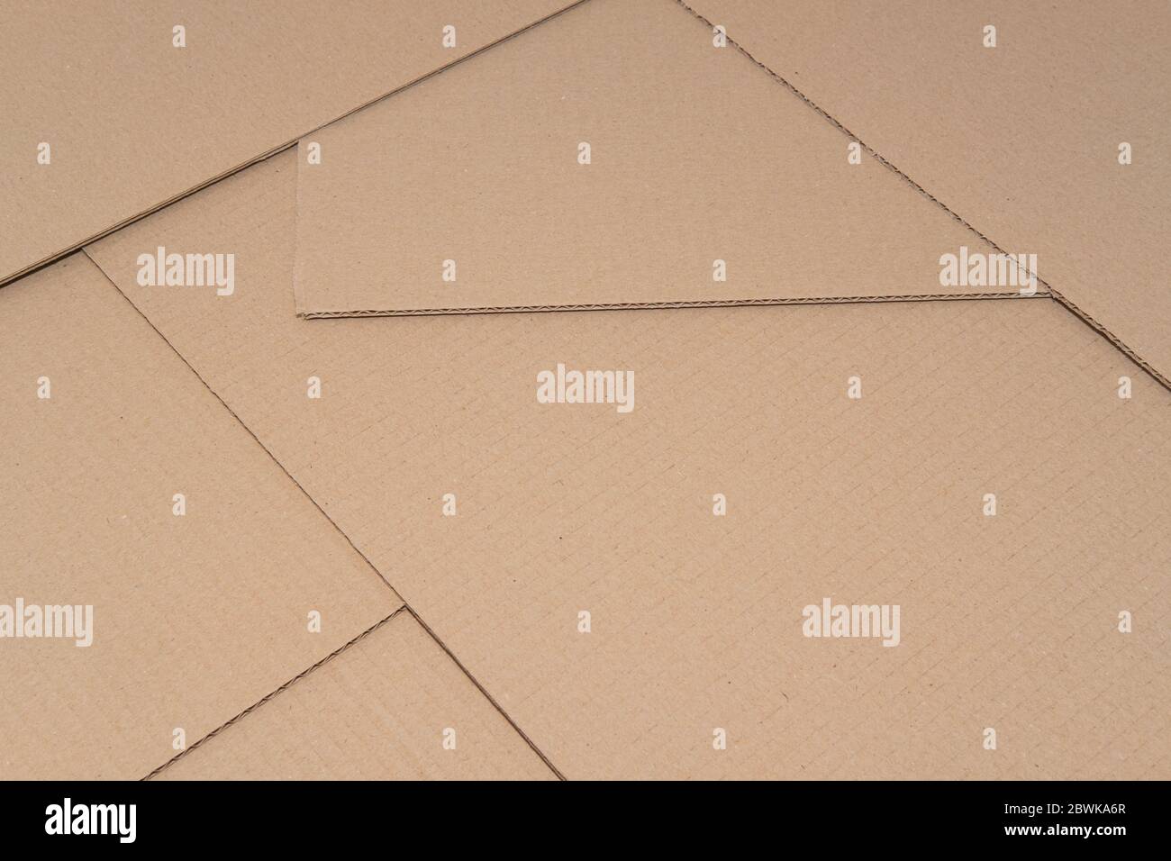 Cardboard paper backdrop, textured background. Natural packaging, brown recycled paper with text copy space Stock Photo