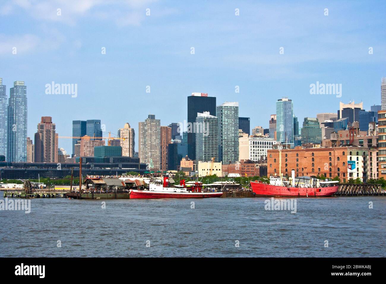 the view from the boat along the Hudson river. You can see buildings , ships and of course, the Liberty Statue. Stock Photo
