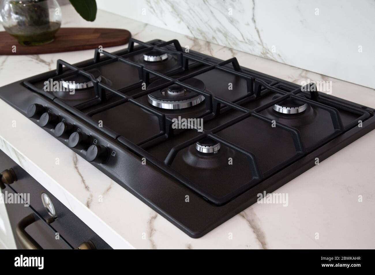 Modern luxurious kitchen and black built-in gas oven detail Stock Photo -  Alamy