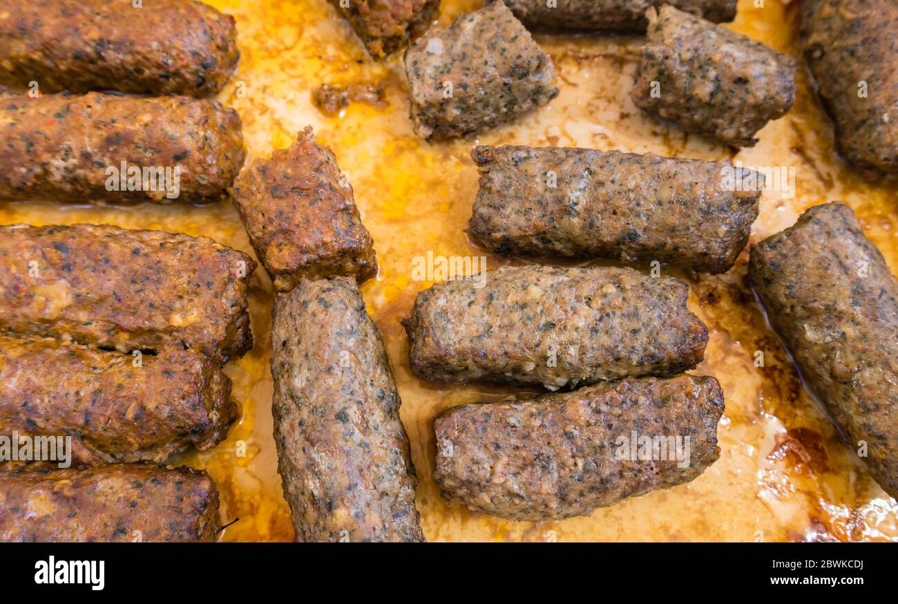 Typical middle-eastern or Lebanese food: cooked sausage-shaped meat kebabs in a dish, popular barbecue food Stock Photo