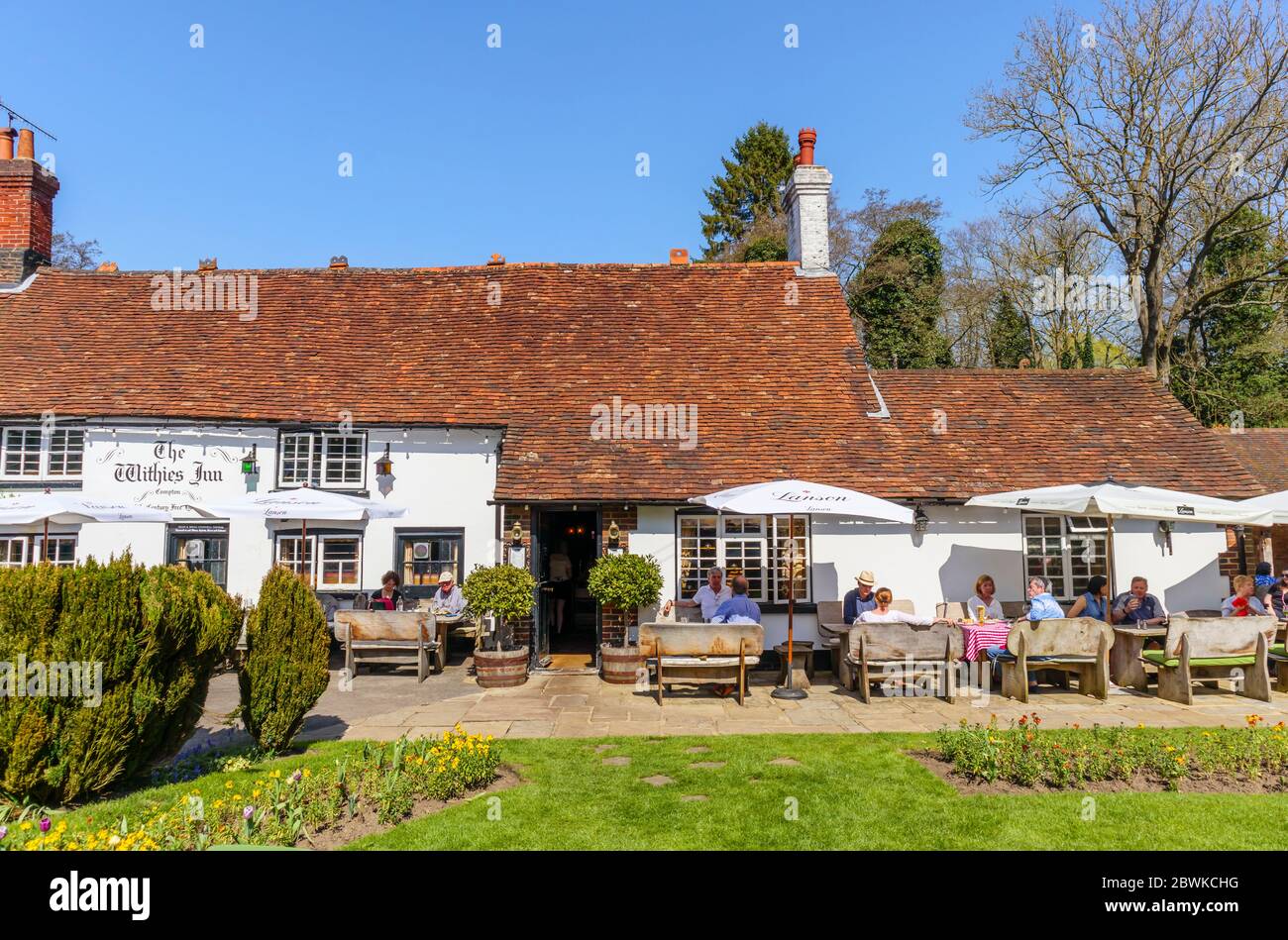 Outdoor dining in the garden of The Withies Inn, a traditional free house country pub in the Surrey village of Compton, southeast England Stock Photo