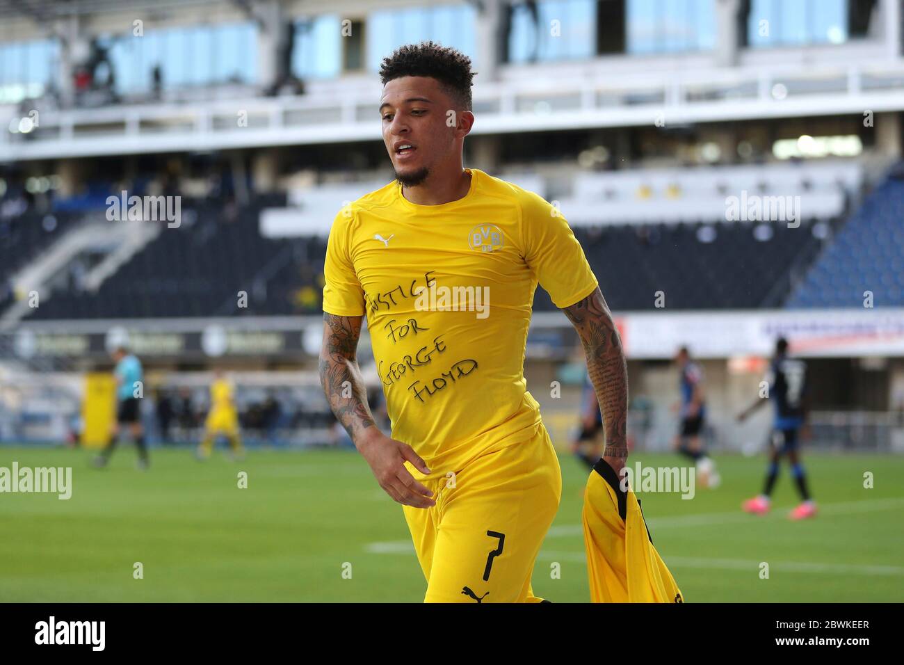 Jadon Sancho of Borussia Dortmund celebrates scoring his teams second goal of the game with a 'Justice for George Floyd' shirt during the German Bundesliga soccer match between SC Paderborn 07 and Borussia Dortmund at Benteler Arena in Paderborn, Germany Stock Photo