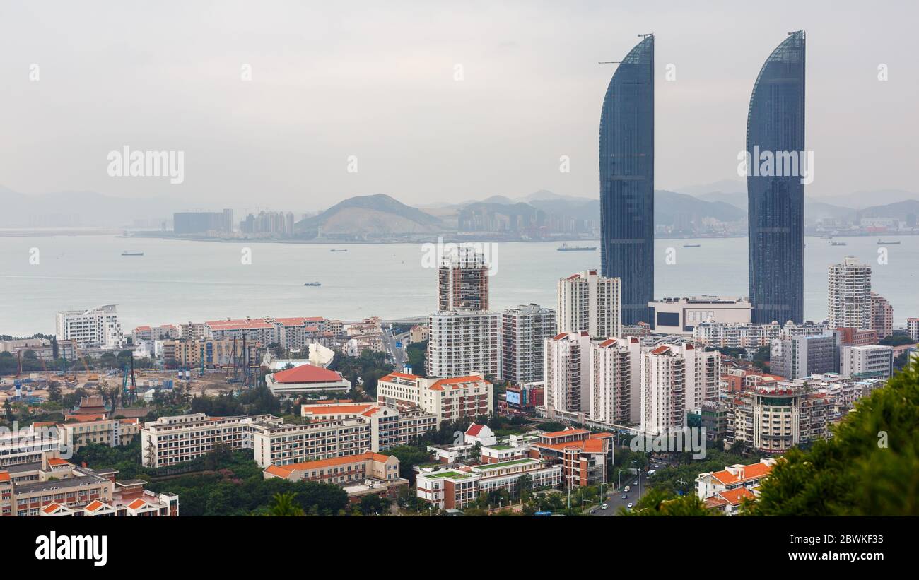 Cityscape of Xiamen with Shimao Straits Towers. In the background the South China Sea. Stock Photo