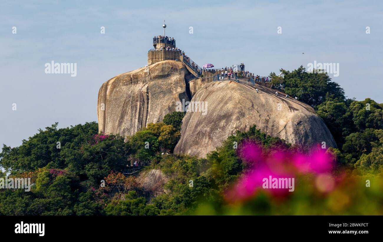View on the Sunlight rock on Gulangyu (also: Kulangsu). A major attraction of the island - packed with tourists. UNESCO world heritage site. Stock Photo