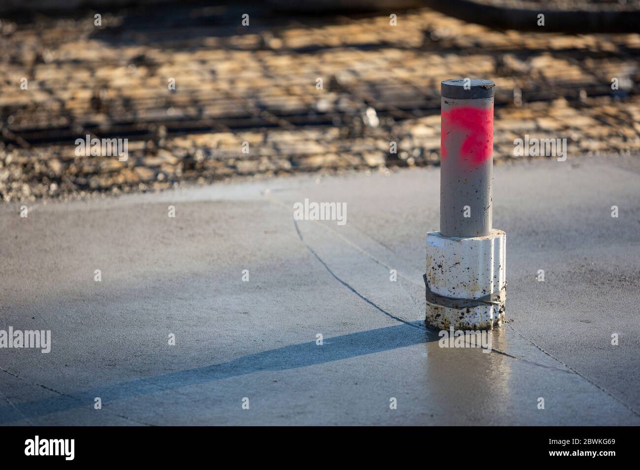 Freshly poured concrete with a plumbing pipe on a residential house slab in Melbounre Australia Stock Photo