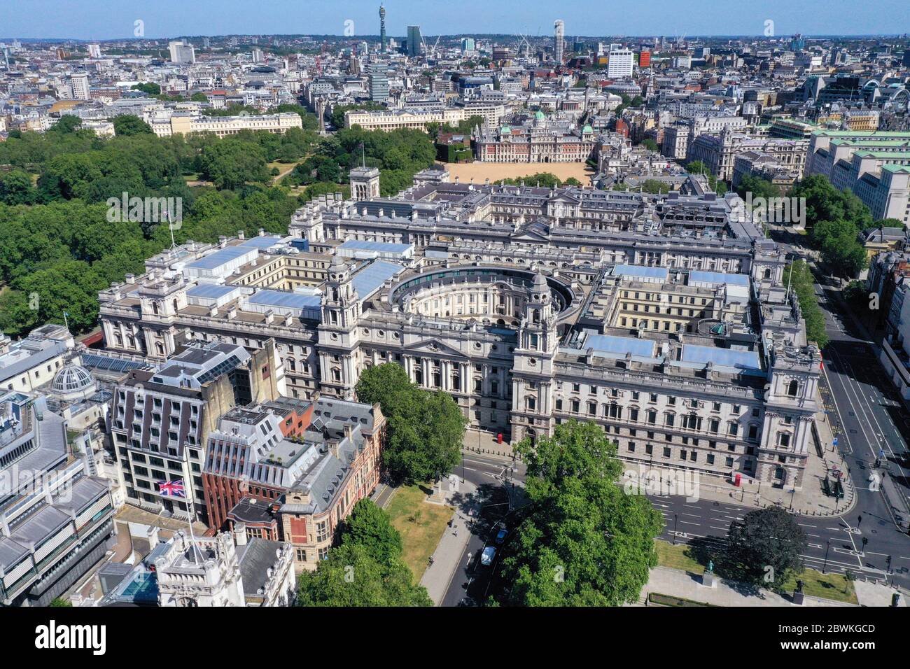 An aerial view of London the junction of Parliament Street and Great George Street, with St James's Park on the left with government buildings which house departments including: The Treasury, the Department for Digital, Culture, Media and Sport, HMRC, the Foreign and Commonwealth Office, Downing Street, the Cabinet Office and Horseguards Parade, and (right) the Ministry of Defence, the Old War Office Building and the Department for International Trade. Stock Photo