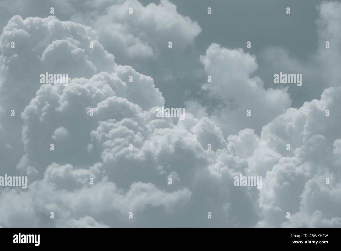 White fluffy clouds on sky. Soft touch feeling like cotton. White puffy cloudscape. Beauty in nature. Close-up group of white clouds texture Stock Photo