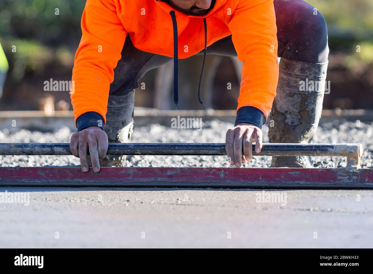 Pouring and leveling a new concrete slab for a residential house under