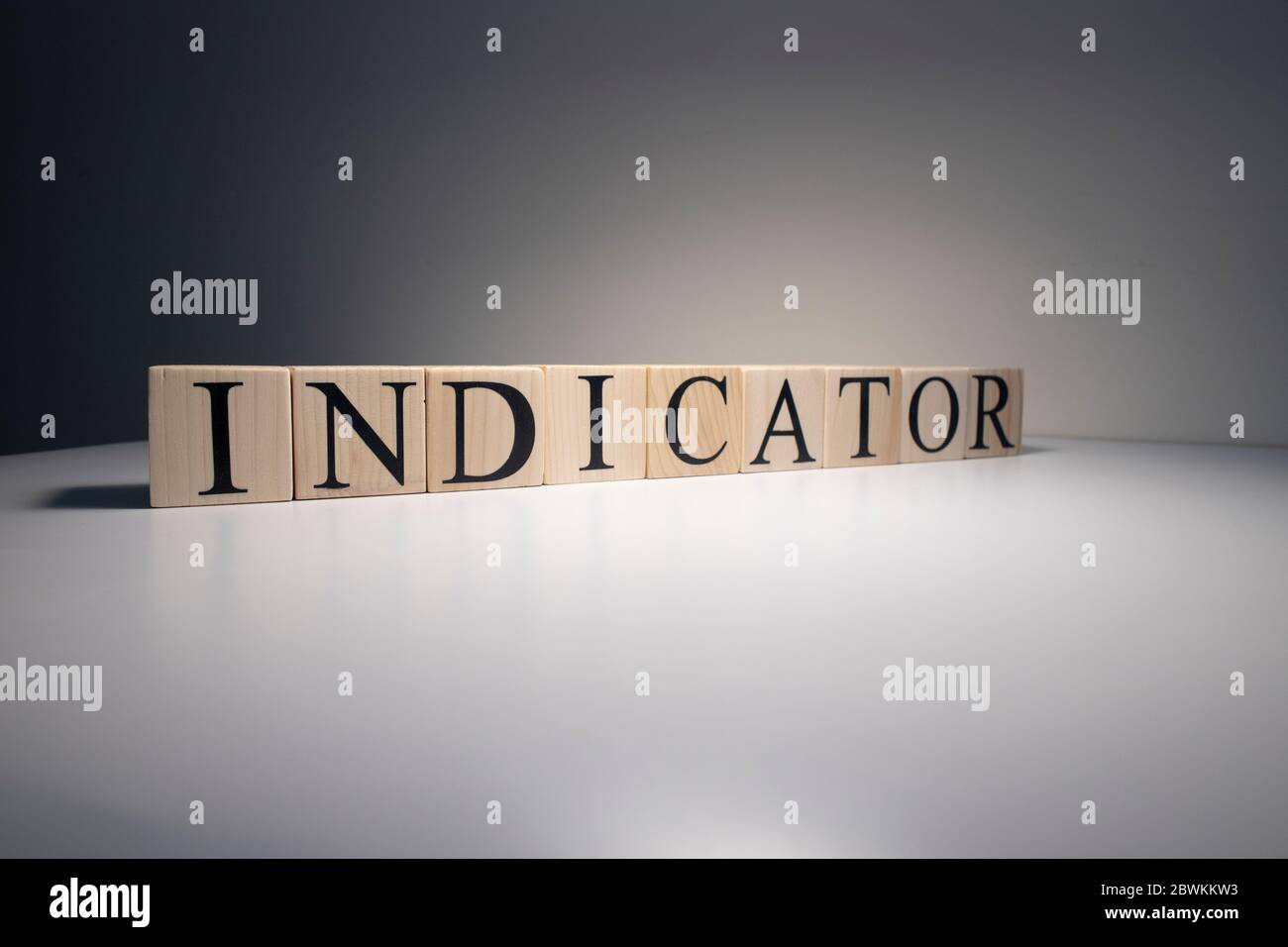 Indicator word from wooden blocks. Business and banking concept. Spot