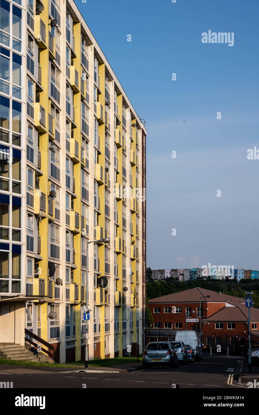 Bristol, England, UK - May 4, 2020: Sun shines on Proctor House, a council housing slab block, on Bristol's Redcliffe council estate, with the colourf Stock Photo