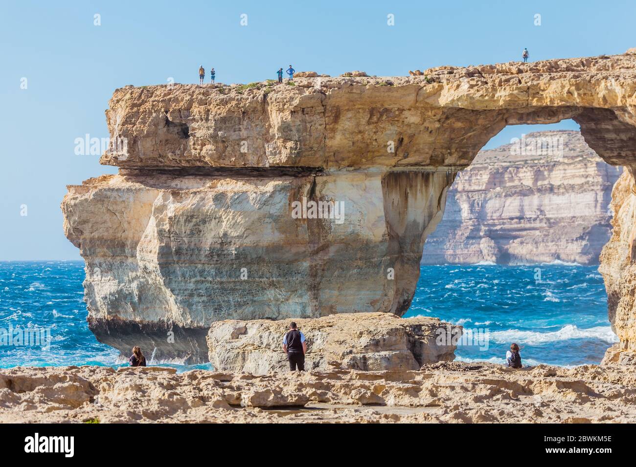 Rough seas at Azure Window in Gozo, Malta. The Azure Window, also known as the Dwejra Window, was a 28-metre-tall (92 ft) natural arch on the island o Stock Photo