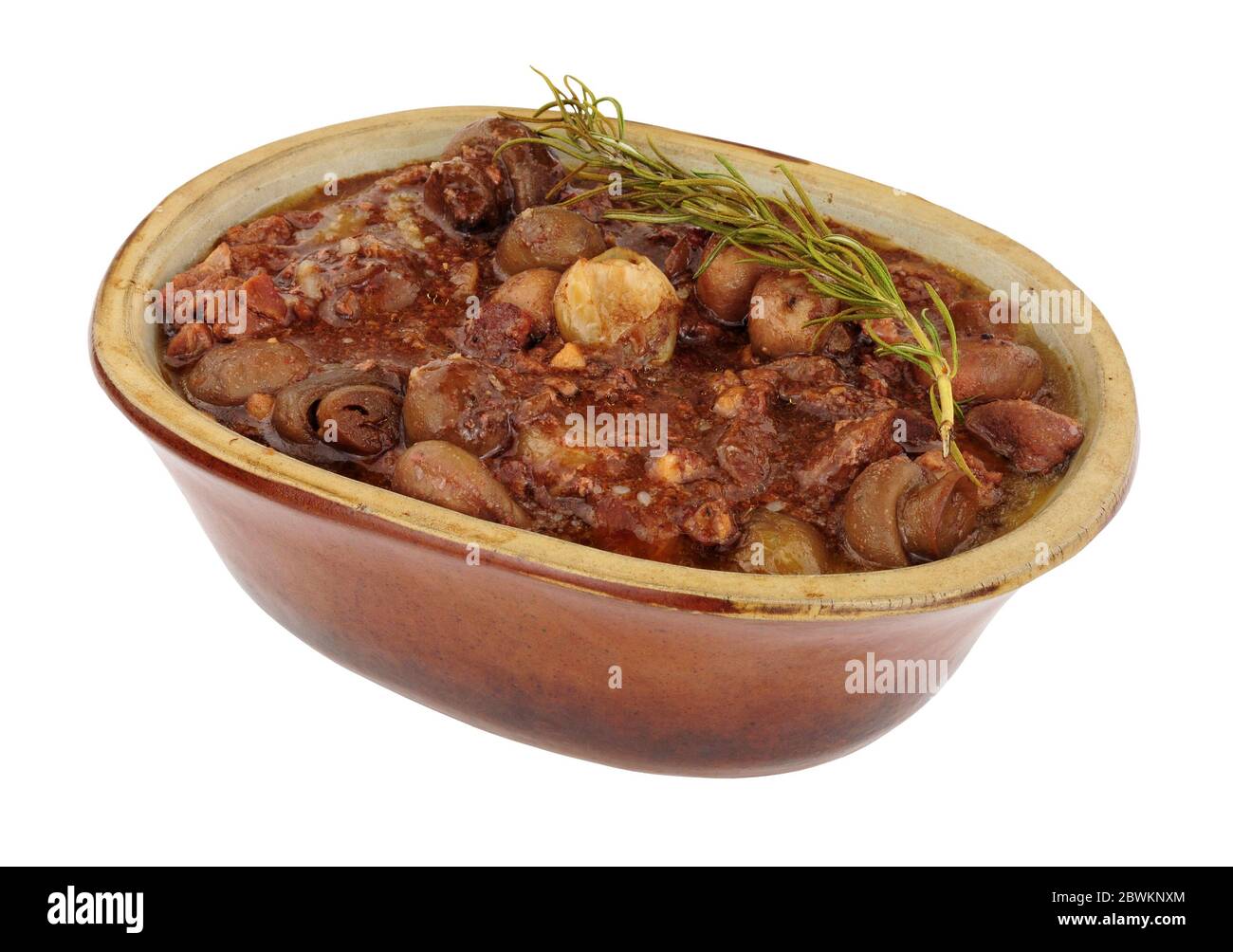 Beef Bourguignon with red wine gravy, mushrooms and shallots in a rustic oven dish isolated on a white background Stock Photo