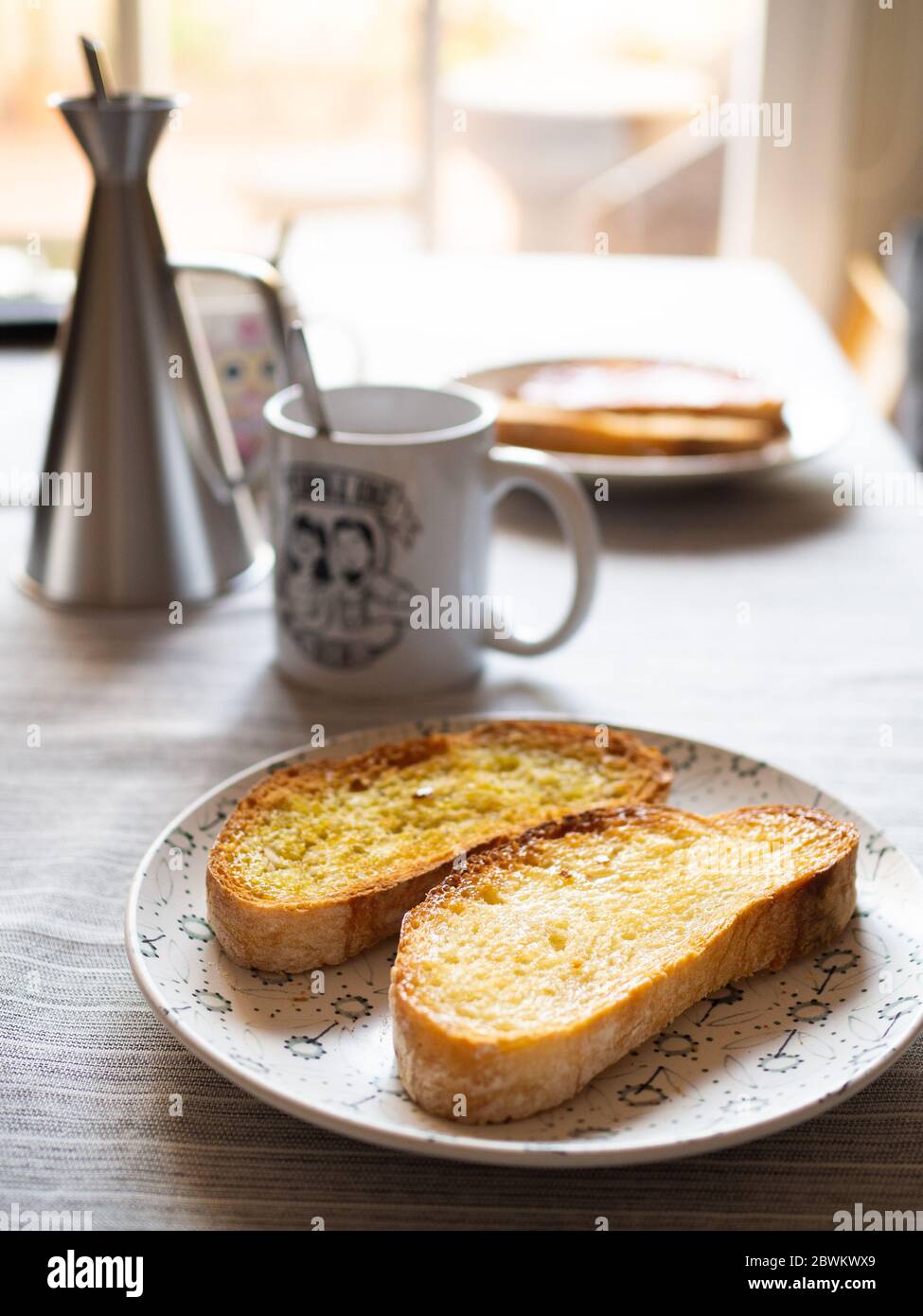 Table with olive oil toasts and freshly brewed coffee Stock Photo