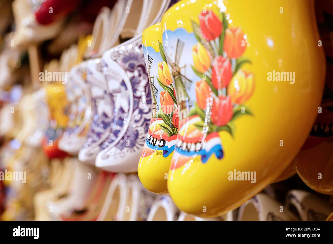 Rack in the store with rows traditional dutch wooden clogs Stock Photo ...