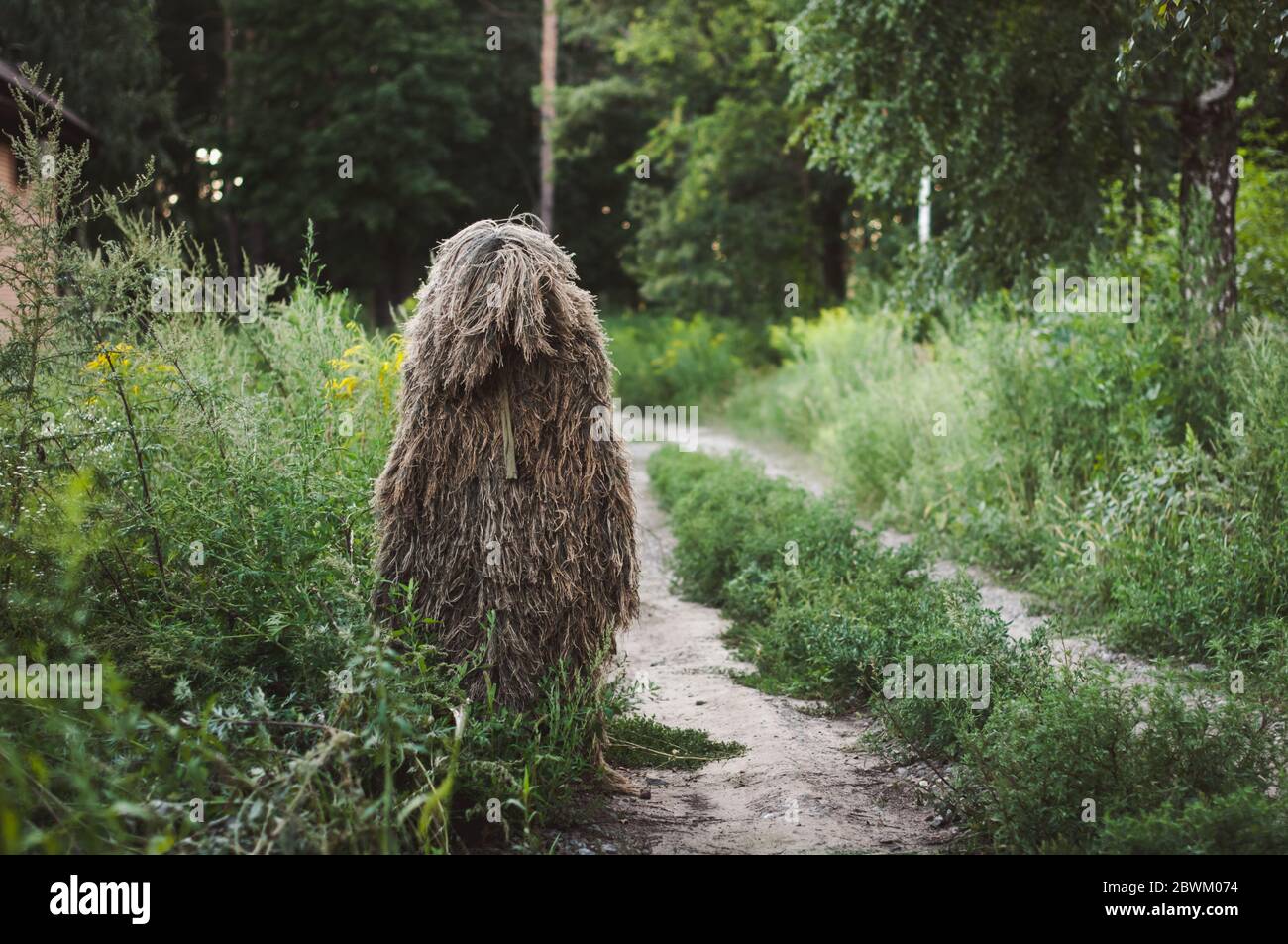 Special camouflage ghillie suit for military, snipers and intelligence agents. In the forest. Stock Photo