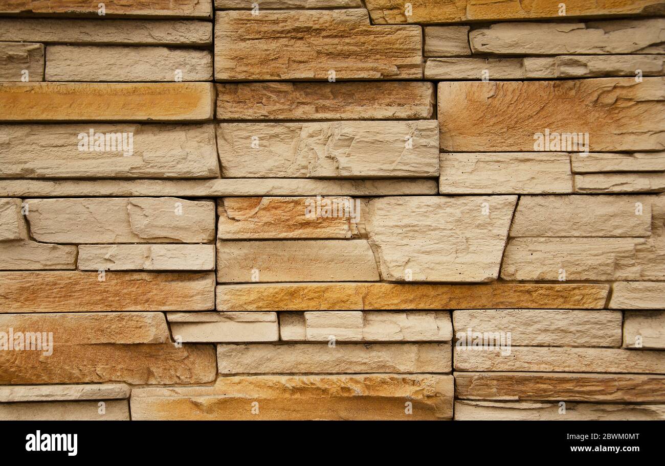 Horizontal yellow modern brick wall for pattern and background Stock Photo