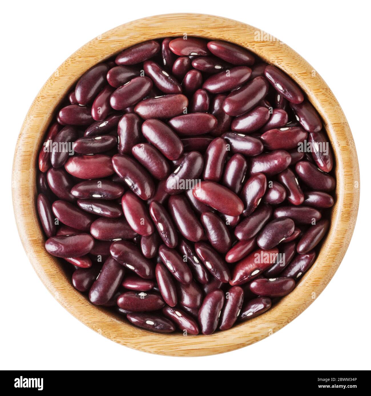 Uncooked red kidney beans in wooden bowl isolated on white background