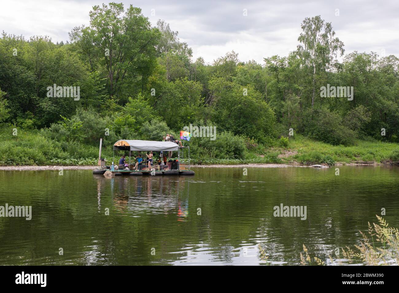 People relax on primitive raft during rafting on River. Tourists ...