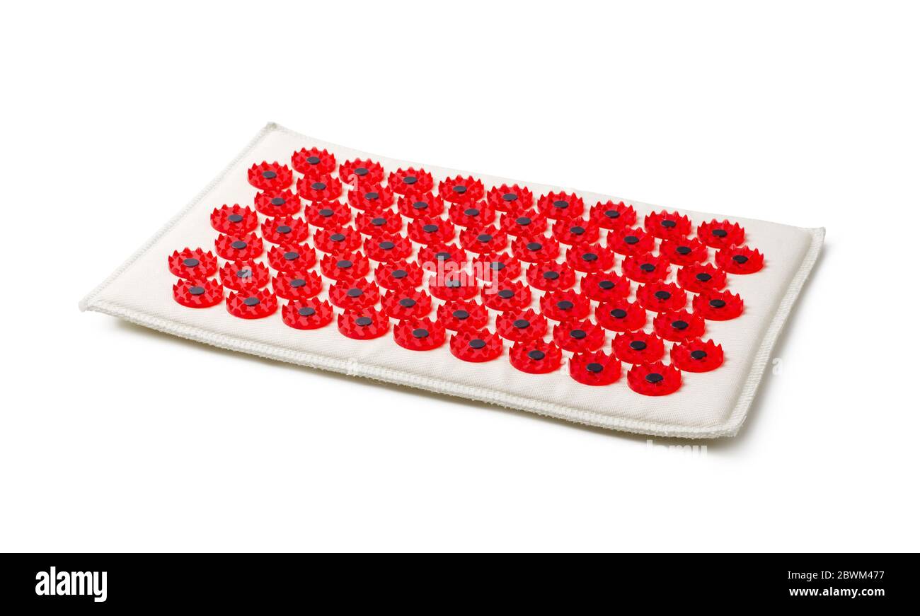 Acupuncture red massager-applicator mat magnets for intense exposure. Needle Kuznetsov applicator isolated on a white background Stock Photo