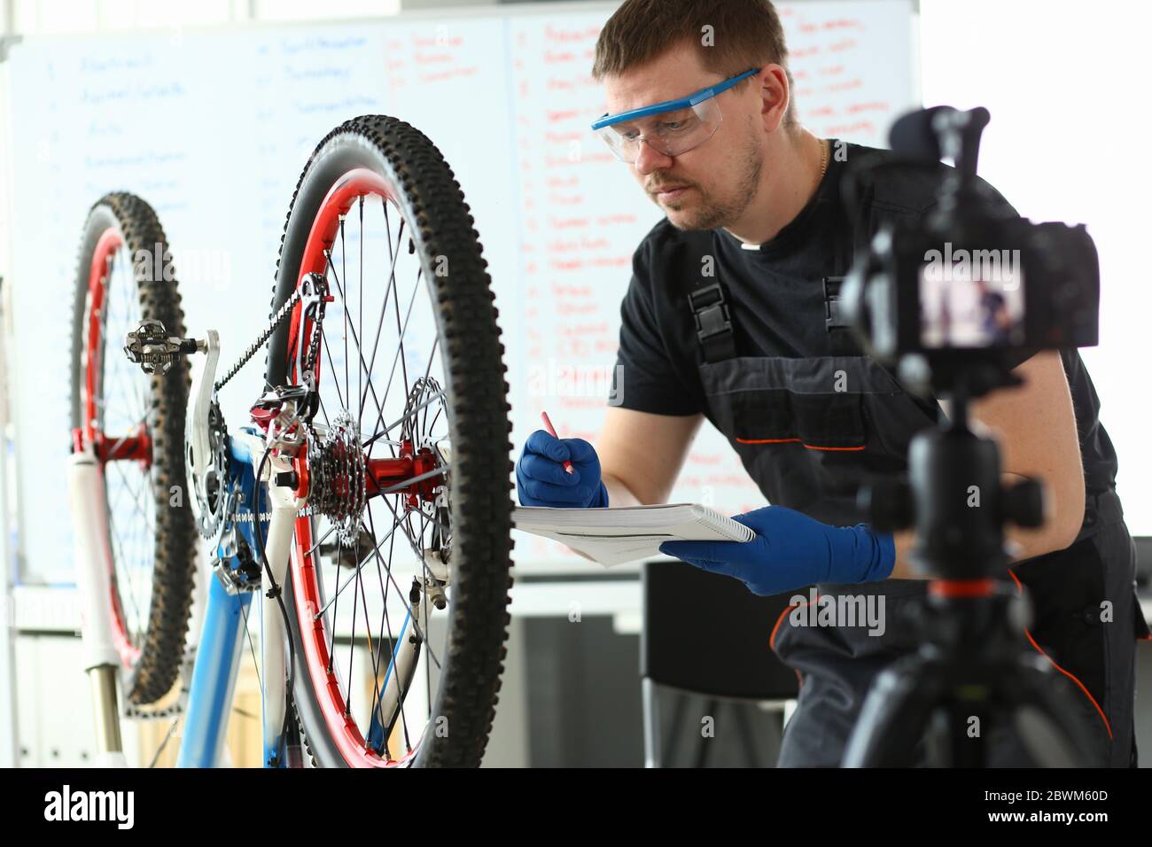 Handsome bearded male person making notes during work Stock Photo
