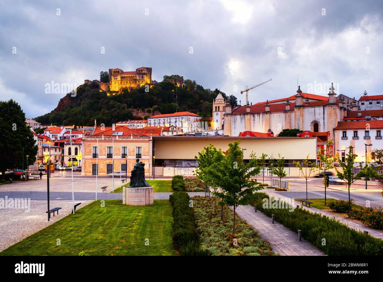 Leiria, Portugal. View of the city and castle in Leiria, Portugal in the evening. Cloudy sky at sunset over the famous landmarks Stock Photo