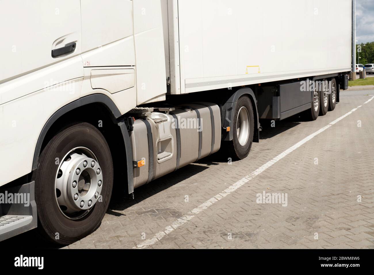 View of the lower part of the 18 wheeled truck. A truck in a parking lot. Stock Photo