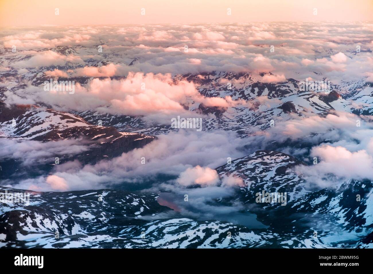 Norway. Aerial view of snowy landscape in winter with mountains and lakes in Norway at sunset. Norwegian fjords in summer from above Stock Photo