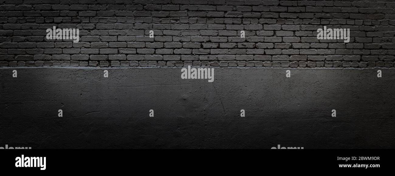 Black brick and stucco vignette panoramic background, subtle pattern backdrop for copy space, horizontal aspect Stock Photo
