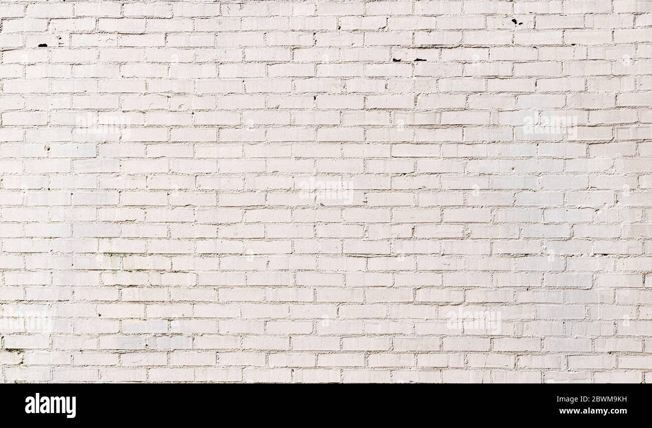 Brick wall painted white, smooth brick with textured mortar, subtle panoramic background pattern for text, horizontal aspect Stock Photo