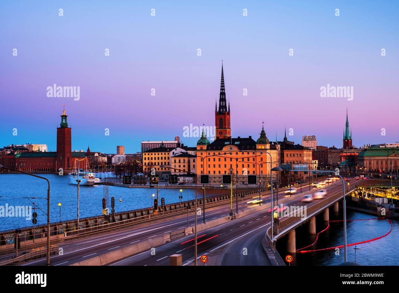 Stockholm, Sweden. View of Gamla Stan in Stockholm, Sweden with landmarks like Riddarholm Church during the morning. View of old buildings and car tra Stock Photo