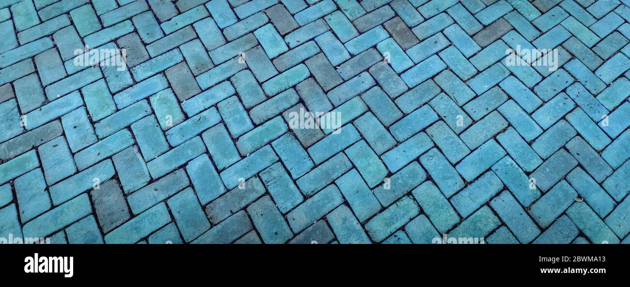Panoramic backdrop in brick herringbone pattern in luminous blue shades, creative copy space, horizontal aspect Stock Photo