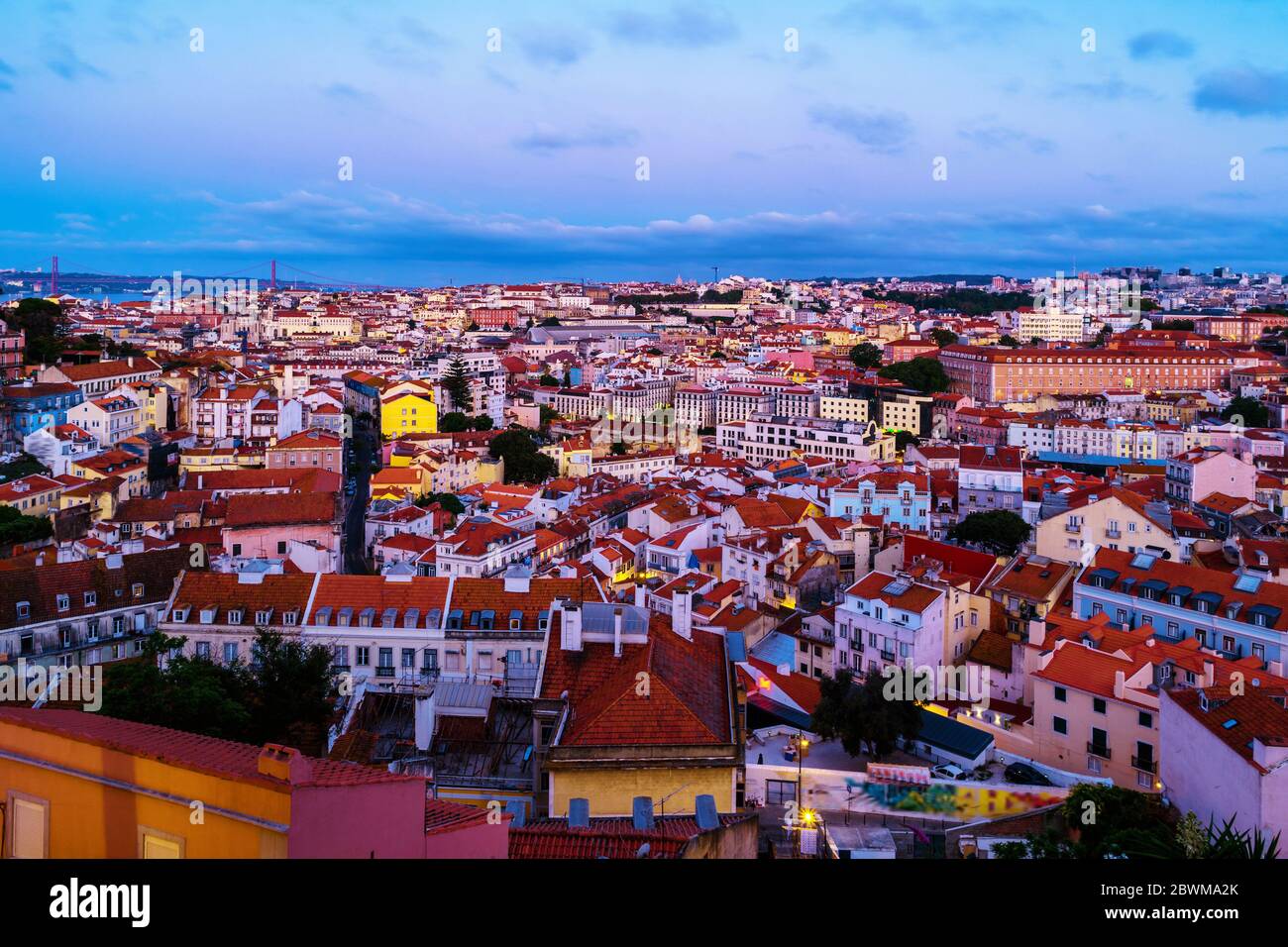 Lisbon, Portugal. Aerial view of Lisbon, Portugal in the sunrise with view over old Alfama and bridge Stock Photo