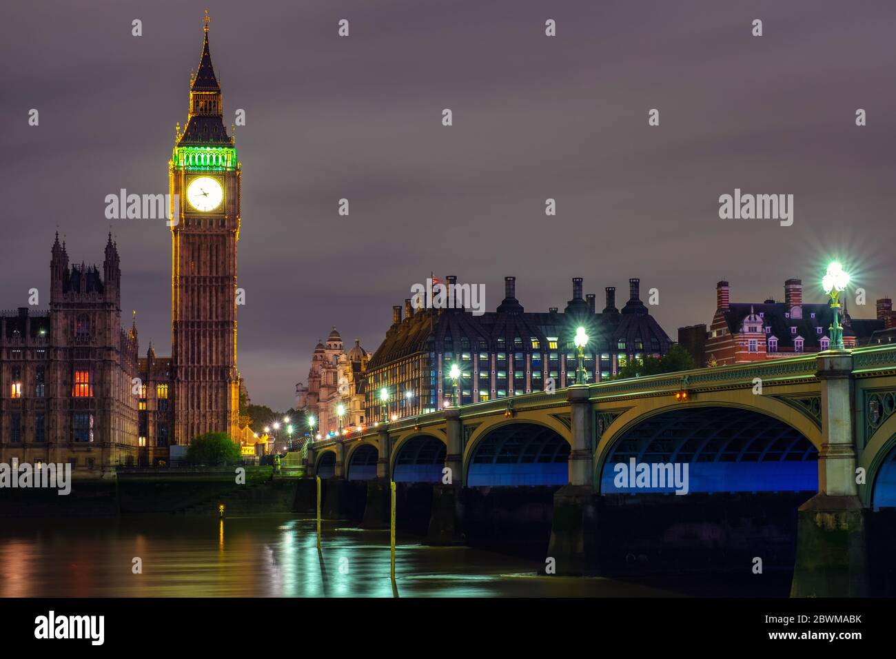 London, UK. Palace of Westminster at night with Big Ben a popular landmark in London, UK. Dark sky, reflection in the Thames river Stock Photo