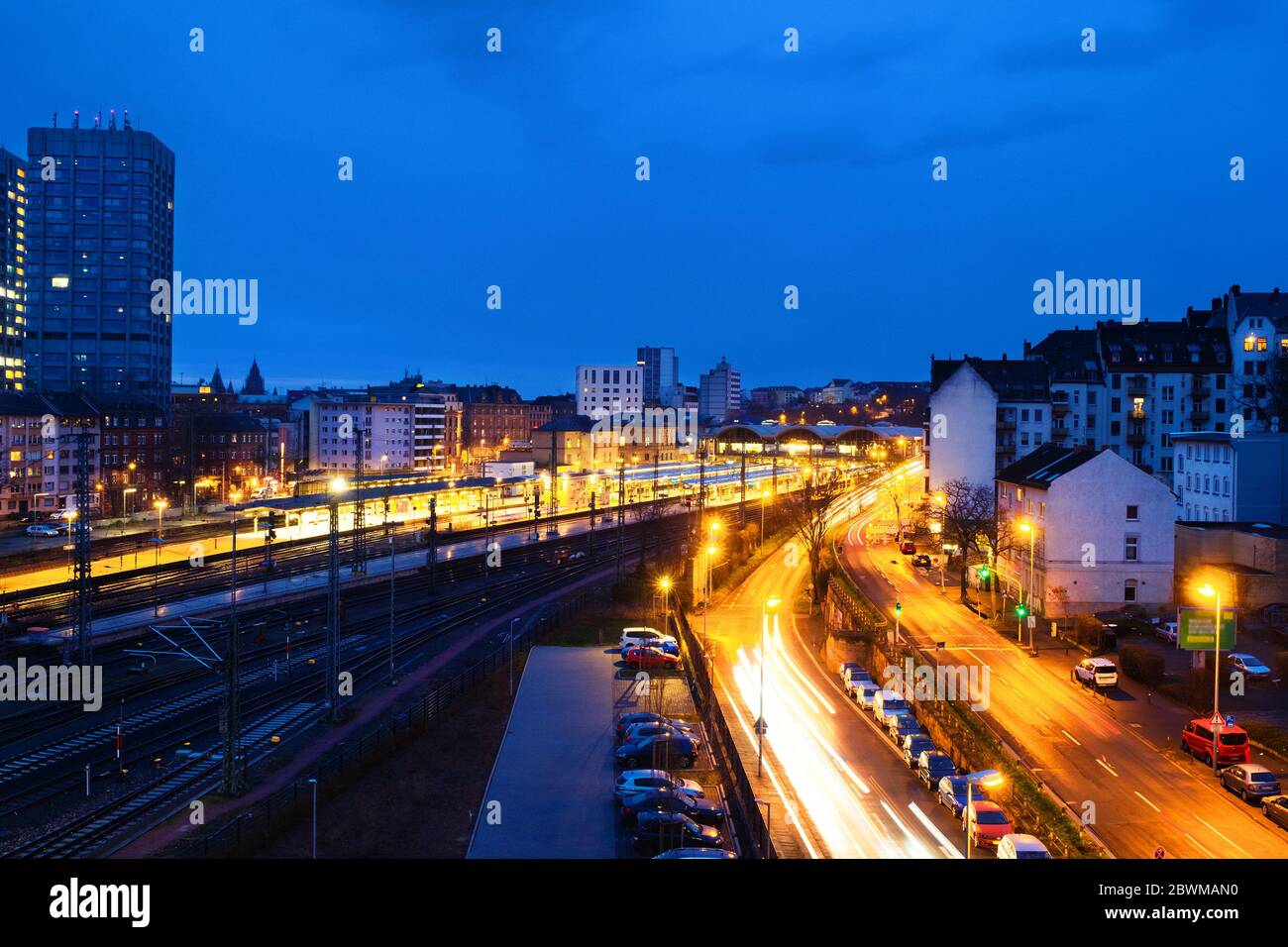 Mainz, Germany. Main train station in Mainz, Germany at night. Illuminated streets with modern buildings Stock Photo