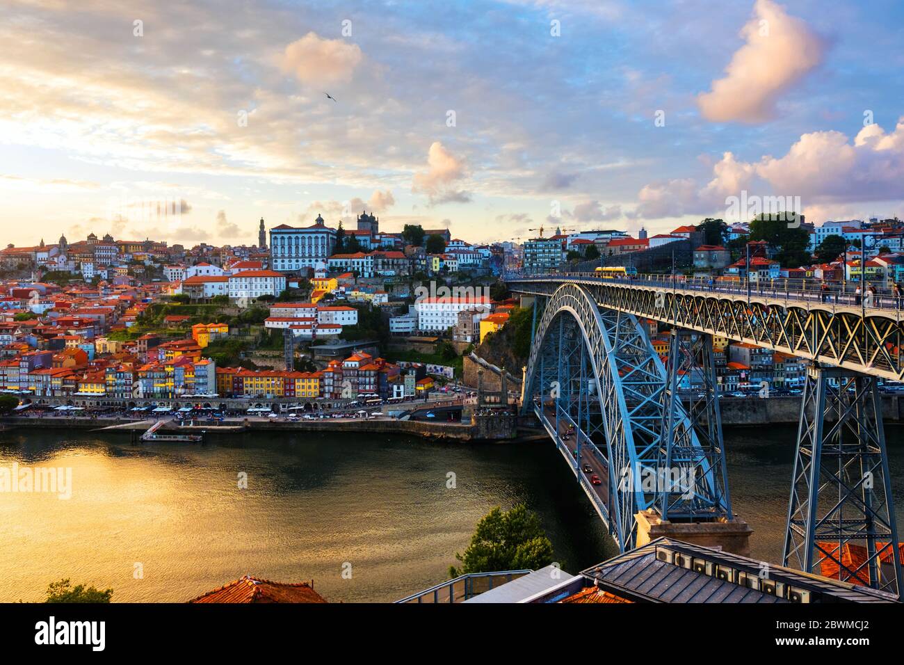 Porto, Portugal. Aerial view of Ribeira area in Porto, Portugal during a sunny evening with river, colorful buildings and bridge Stock Photo