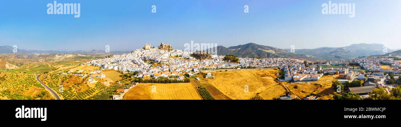 Olvera, Spain. Aerial view of old touristic town Olvera, Spain surrounded by mountains. Dry landscape in hot summer, White houses in Spanish village Stock Photo