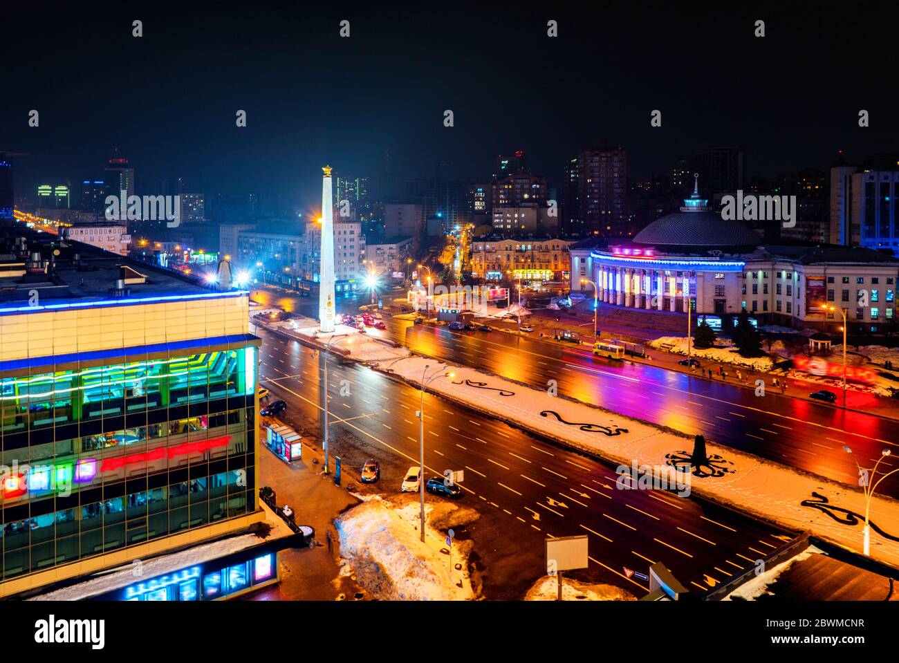 Kyiv, Ukraine. Aerial view of a city center in Kyiv, Ukraine, with traffic at night. Aerial view of Victory square with dark sky Stock Photo