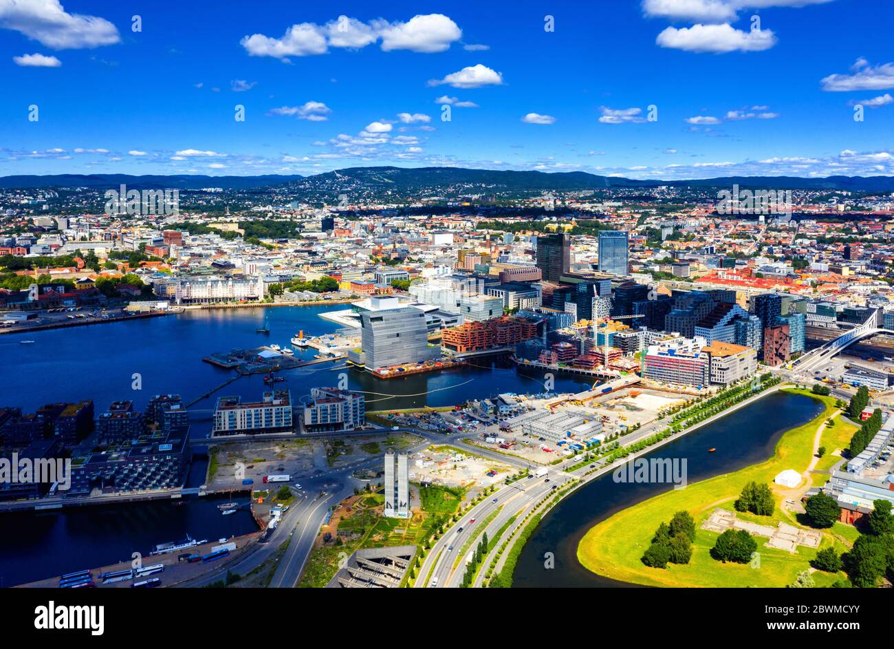 Oslo, Norway. Aerial view of Sentrum area of Oslo, Norway, with Barcode buildings and the river Akerselva. Construction site with blue sky during a su Stock Photo